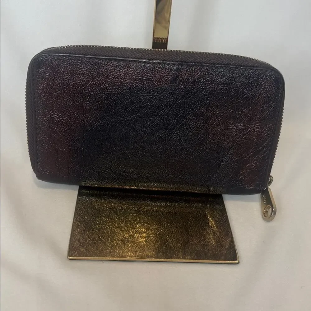 Chloe Lilly bow front long wallet in a metallic maroon brown